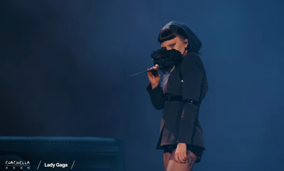 Lady Gaga holding black bouquet of flowers