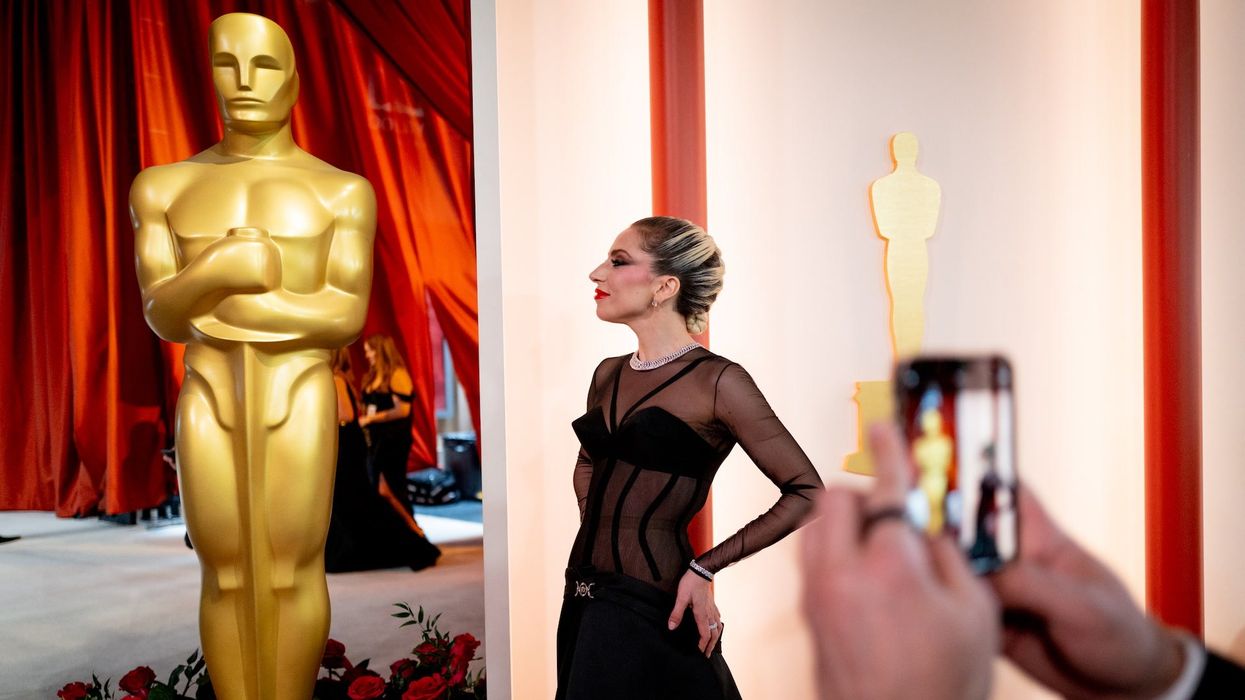 Lady Gaga reacts after photographer falls to the ground right in front of her