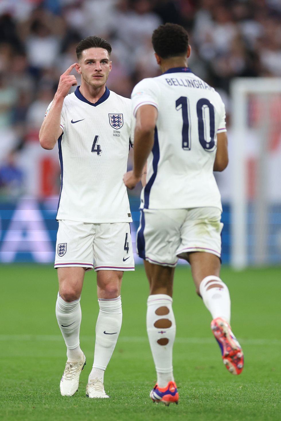 Why do footballers cut holes in their socks? indy100