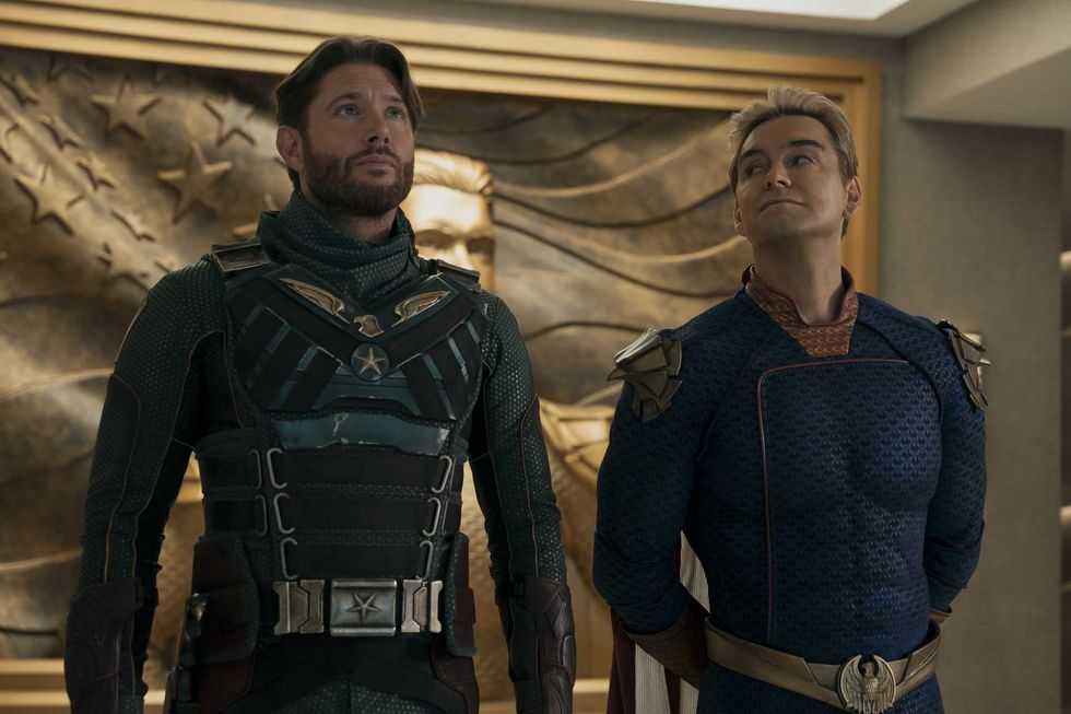 Left, Jensen Ackles as Soldier Boy, a bearded white man with short brown hair and a green costume. Right, Antony Starr as Homelander, a white man with short blonde hair and a blue costume.