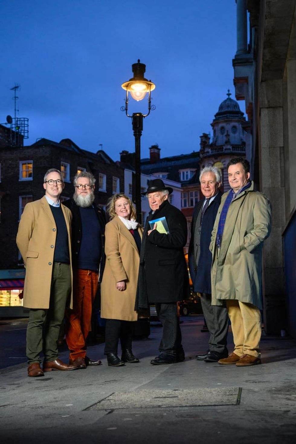 (left to right) Arts and Heritage minister Lord Parkinson, campaigner Tim Bryars, MP Nickie Aiken, actor Simon Callow, Historic England chief executive Duncan Wilson and campaigner Luke Honey stand under one of four gas lamps along Russell Street in Covent Garden, London that have today been given Grade II listing protection.