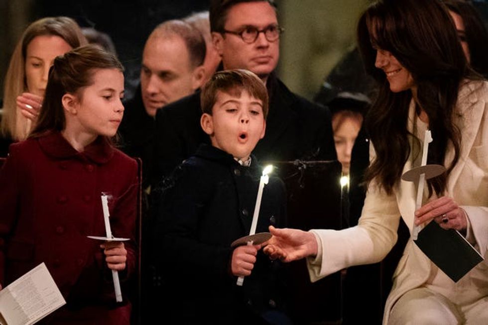 (left to right) Princess Charlotte, Prince Louis blowing out his candle and the Princess of Wales during the Royal Carols \u2013 Together At Christmas service at Westminster Abbey in London.