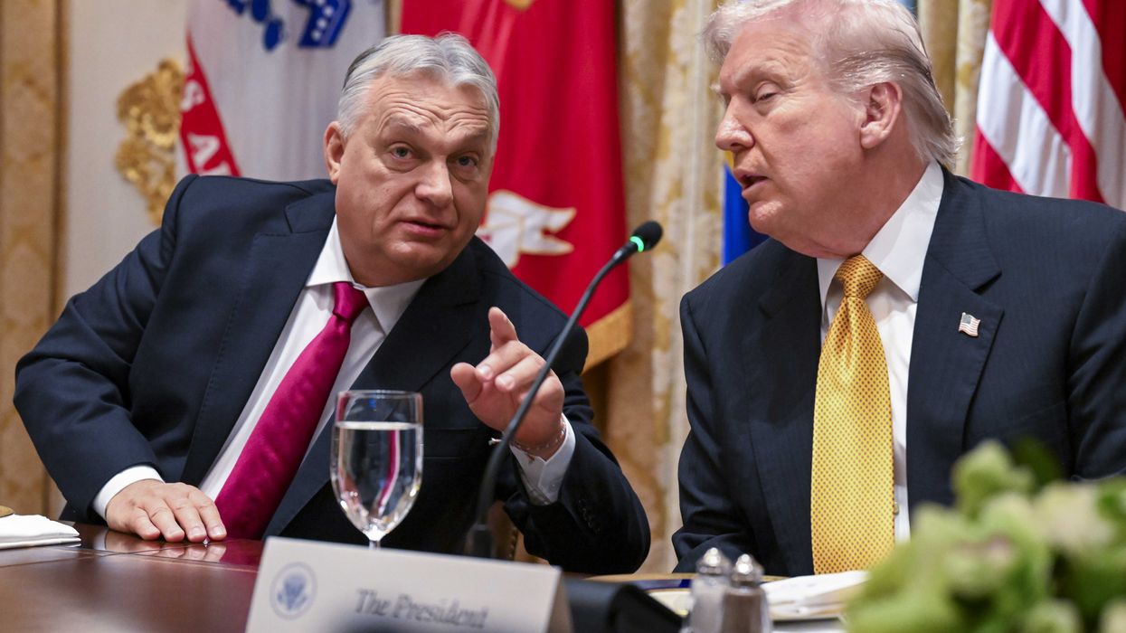 Left, Viktor Orbán points at someone off-camera in front of him. Right, US president Donald Trump listens. They are both sat at a wooden desk.