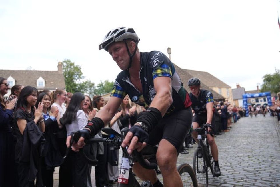 Lewis Moody after arriving at his former school, Oakham School in Rutland, on day three of the Lewis Moody XV Cycle Challenge.