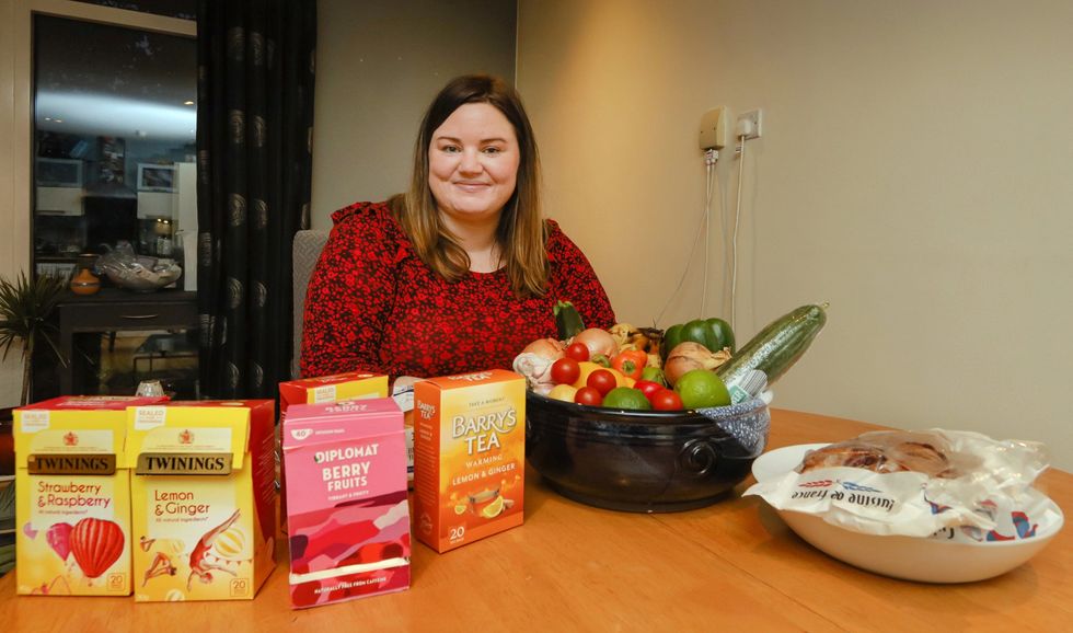 Lindsay Ray with a selection of foodstuffs that she will share on Olio (Willie Dillon/Olio/PA)
