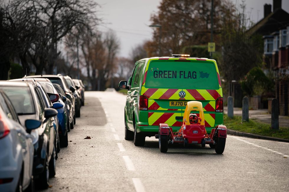Little Green Flag tows away 8-year old Noah Montenegro\u2019s used toy car to be recycled as part of the brand\u2019s purpose-led recover and reward service (Aaron Chown/PA Wire)