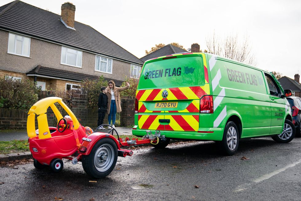 Little Green Flag tows away Noah Montenegro\u2019s used toy car to be recycled (Aaron Chown/PA)