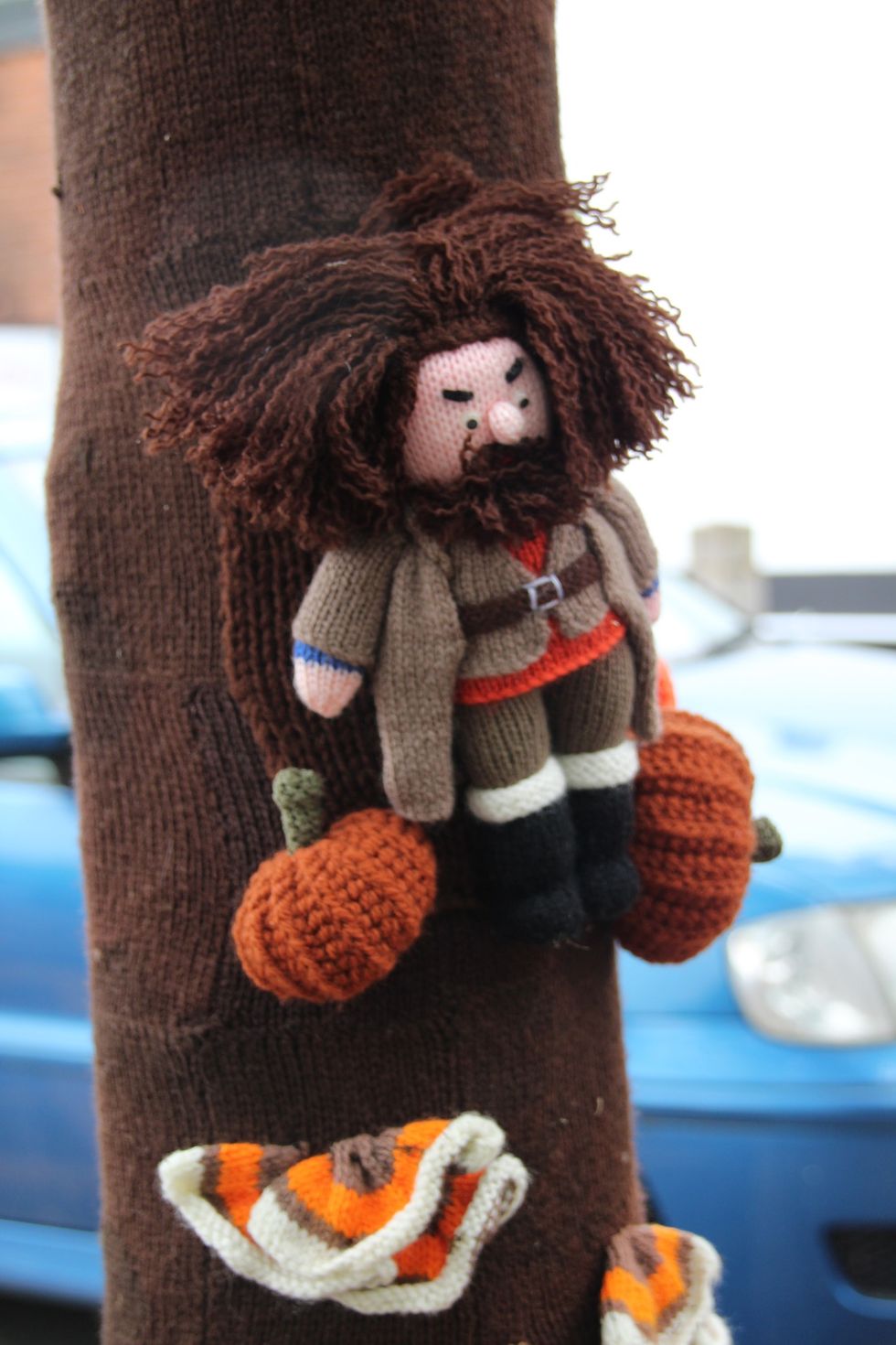 Little man made from yarn on a tree