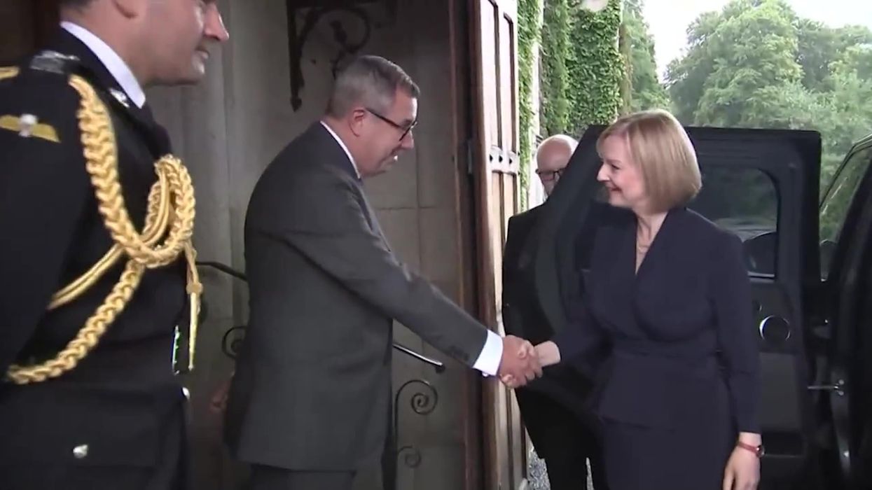 Liz Truss looks like a giant in her pictures meeting the Queen