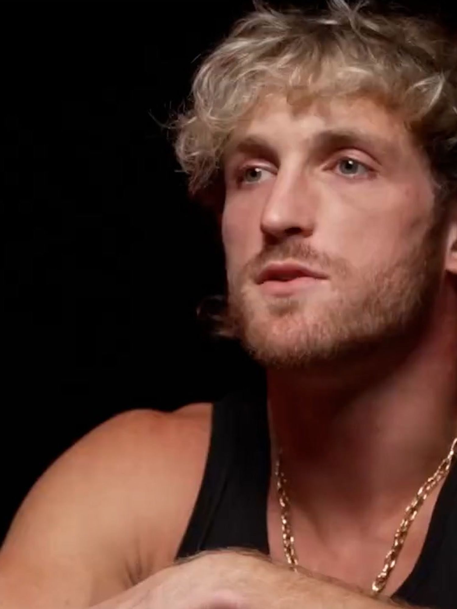 Logan Paul, a white man with curly blonde hair.
