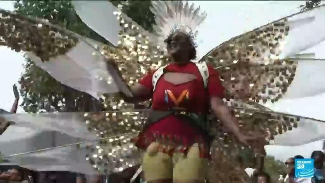 Horrifying moment shows revellers crash through top of bus stop on to people below