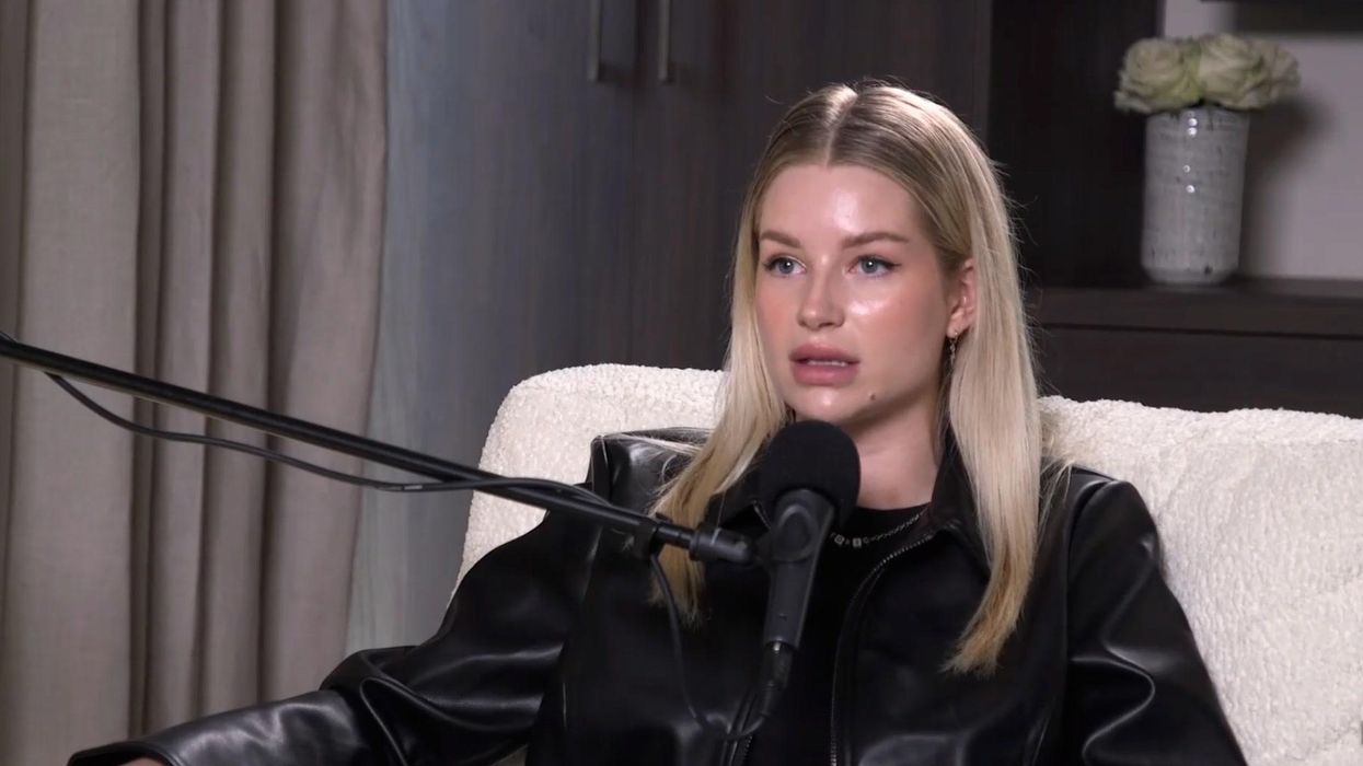 Lottie Moss podcast interview portrait Lottie Moss speaking into a podcast microphone in a black leather jacket