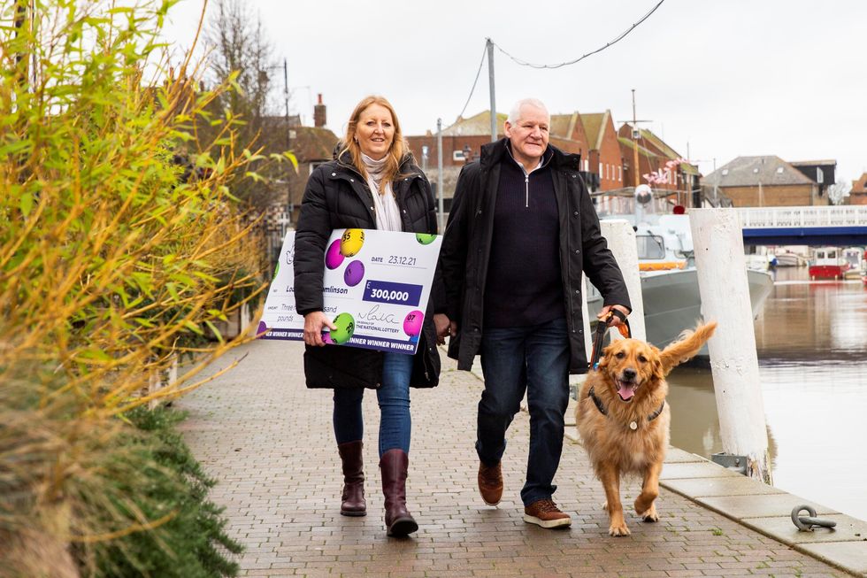 Louisa and Greg Tomlinson with their dog, Teddy (James Robinson/Camelot)