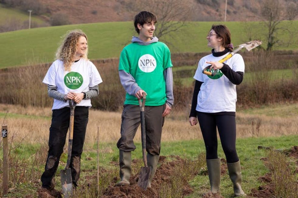 Lucy-Bell-Reeves, George Barnsley and Olivia Wilson planting trees