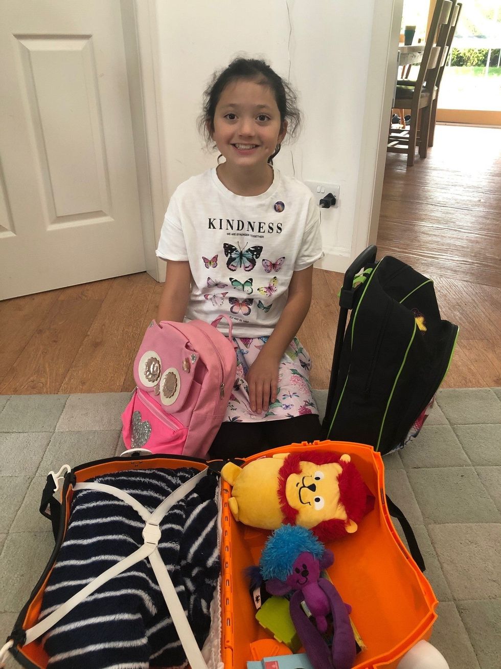 Lucy Johnstone prepared bags of her own clothes for refugee children (British Red Cross/PA)