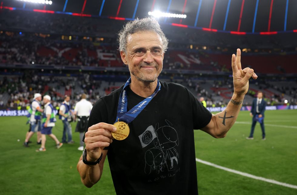 Luis Enrique, Head Coach of Paris Saint-Germain, poses for a photo with his winners medal, after their team's victory, to secure Paris Saint-Germain's first ever UEFA Champions League title in the club's history and a record UEFA Champions League Final winning scoreline of 5-0, following during the UEFA Champions League Final 2025 between Paris Saint-Germain and FC Internazionale Milano at Munich Football Arena on May 31, 2025 in Munich, Germany