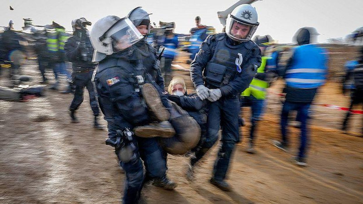 German police stopped by 'mud wizard' during coal mine protest