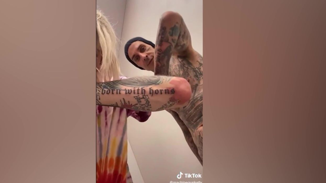 Machine Gun Kelly changes album name after getting it tattooed on Travis Barker