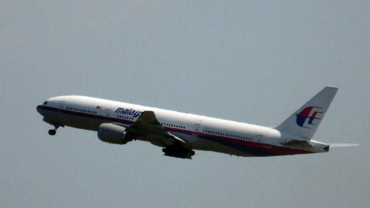 Malaysia Airlines flight MH17 pictured shortly after take-off at Amsterdam's Schiphol airport on Thursday