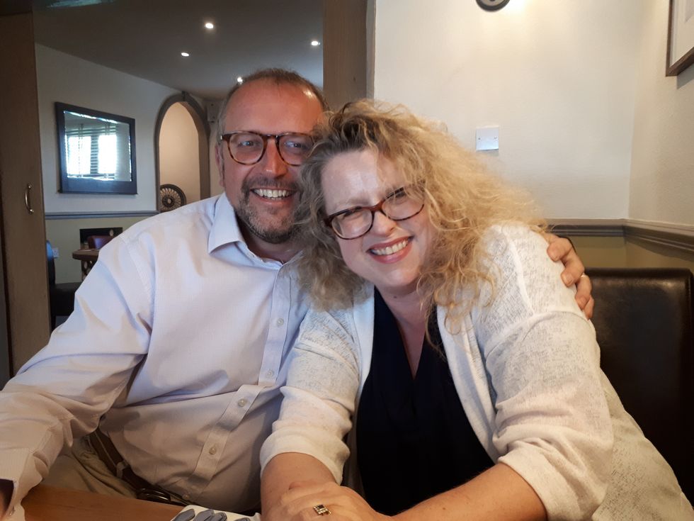 Man and woman posing together