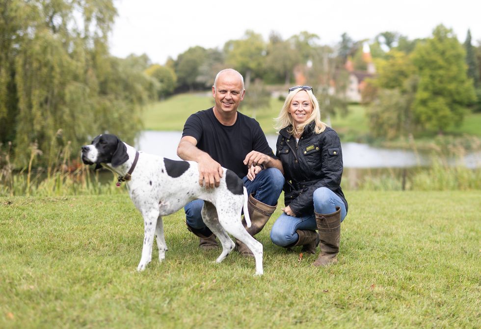 Man and woman with dog