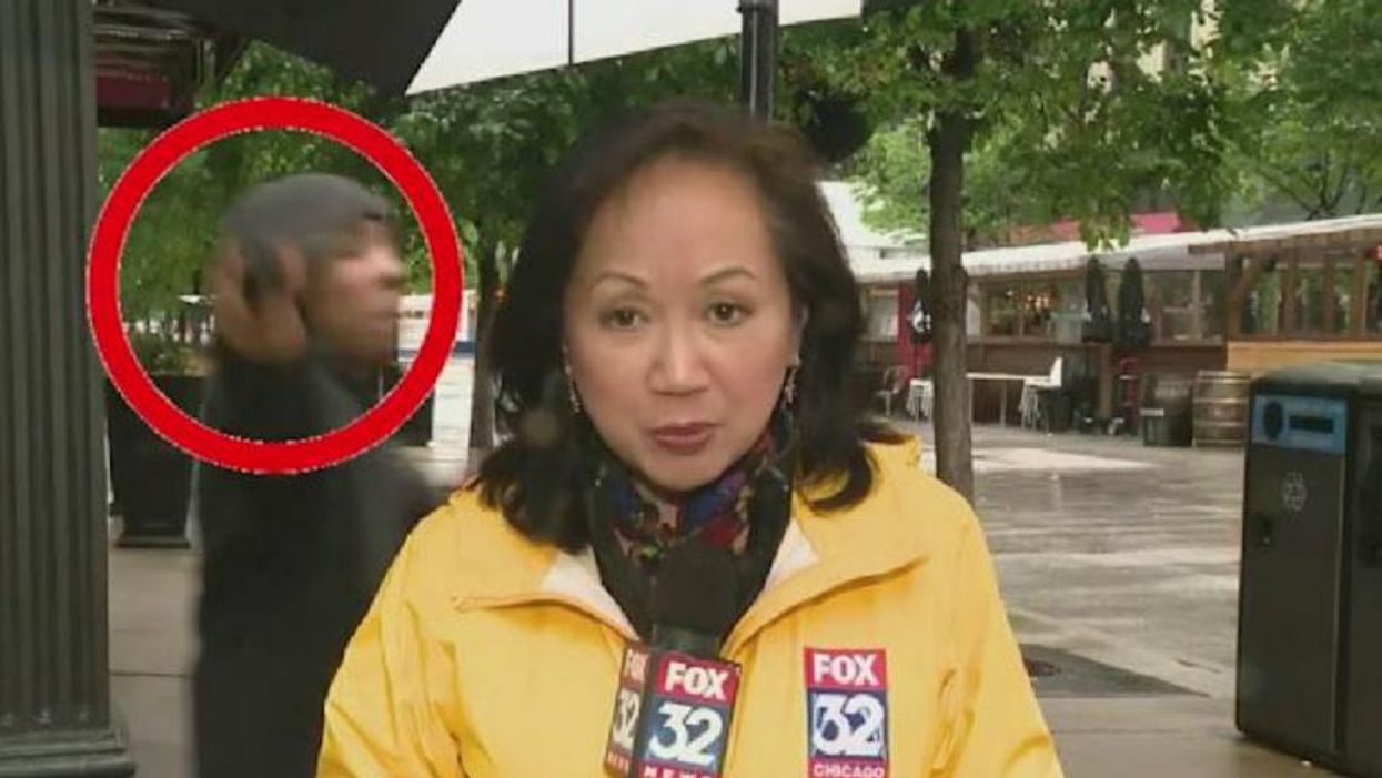 Man appears to pull out firearm during live news report on gun violence