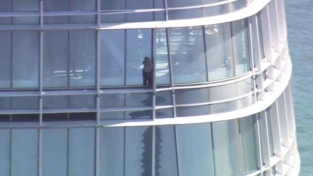 Terrifying moment abortion protestor scales 61-storey building with no ropes