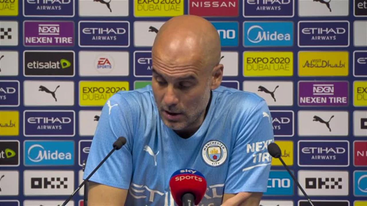 Pep Guardiola looks 'scared' after being chased by fan on a bike