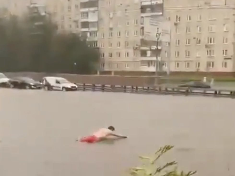 Man decides to take a plunge in flood waters amid \u201csuperstorm\u201d chaos