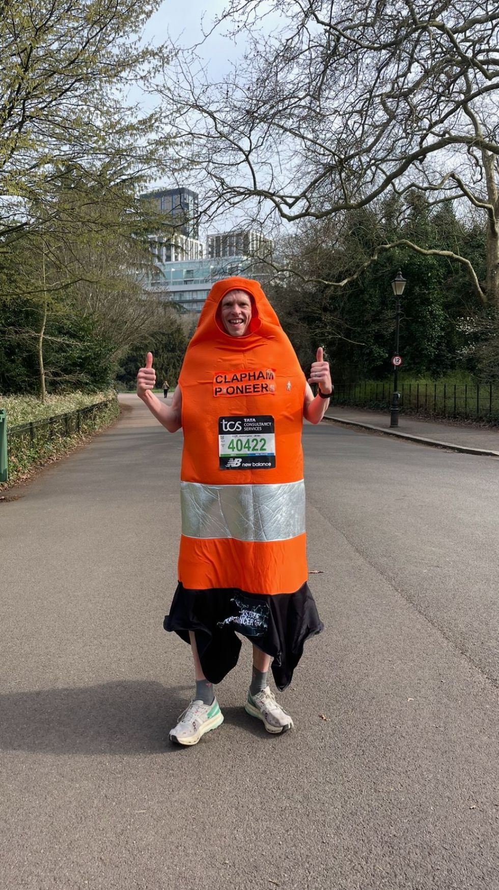 Man dressed in an orange traffic cone costume
