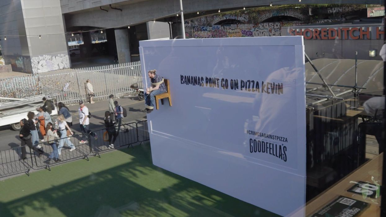 Man gets strapped to a giant billboard and shamed for loving banana on pizza