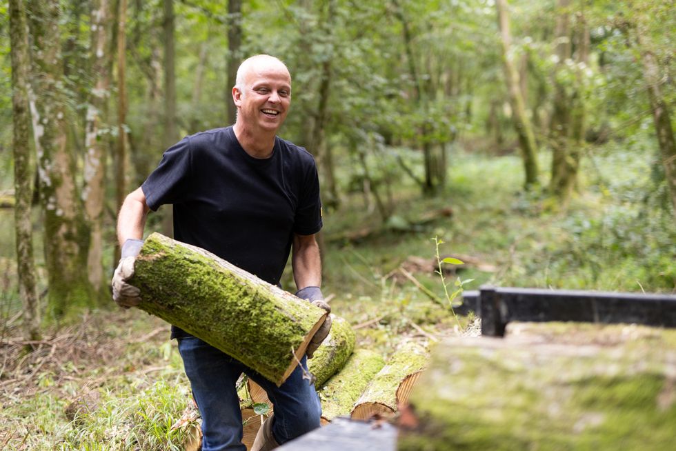 Man holding log