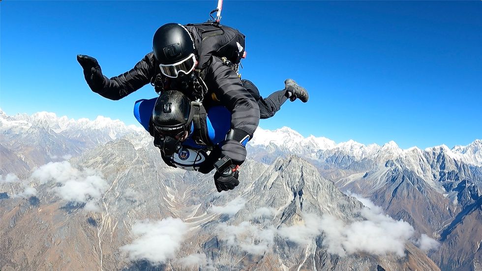 Man in tandem skydive through the Himalayas