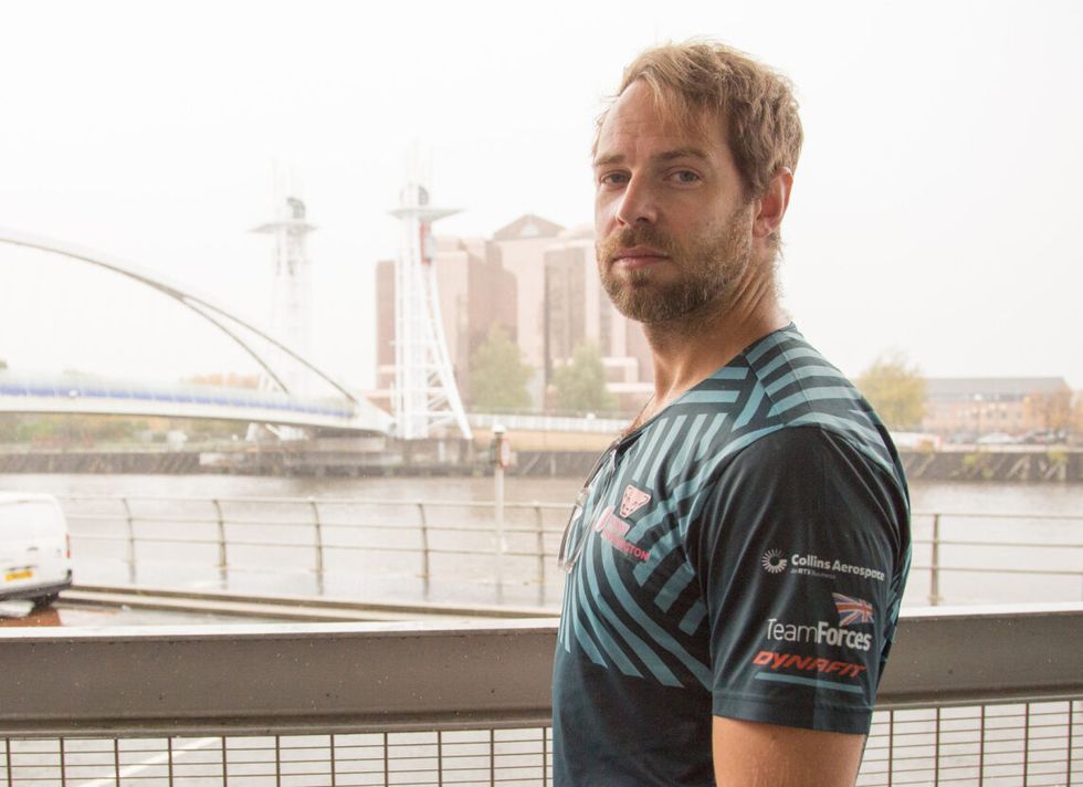 Man looking at the camera and facing sideways