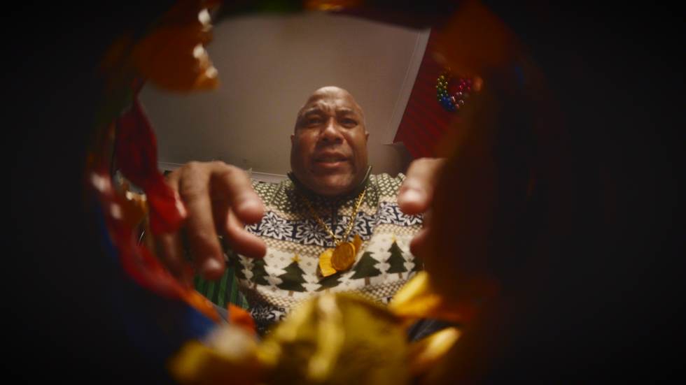 Man looking inside box