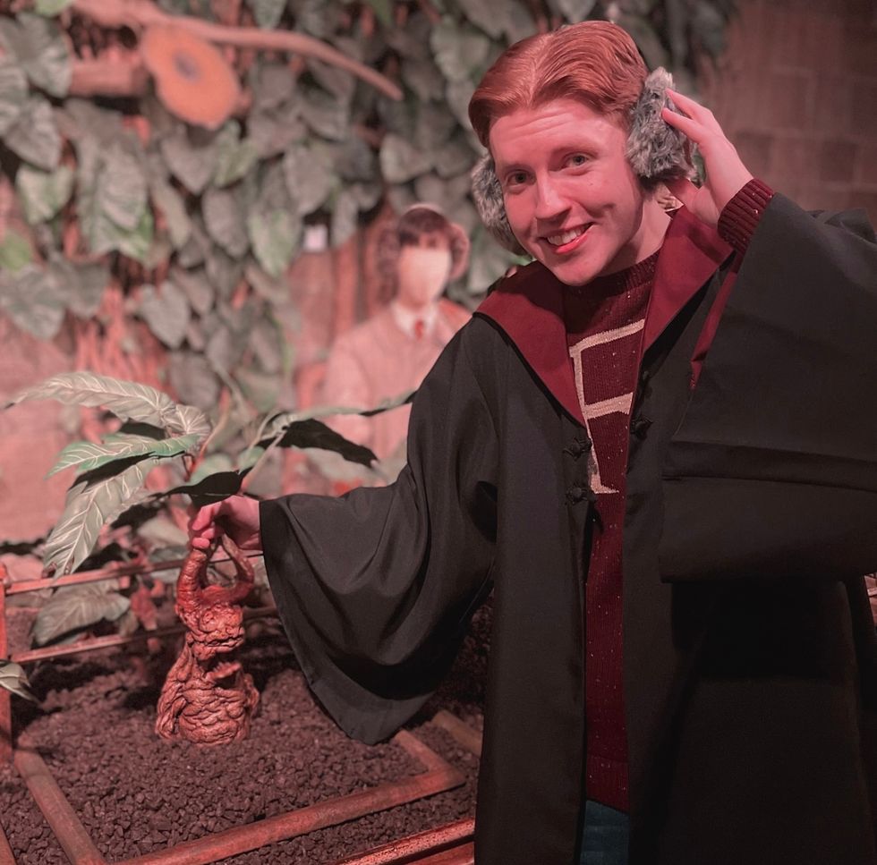 Man posing with Harry Potter gear