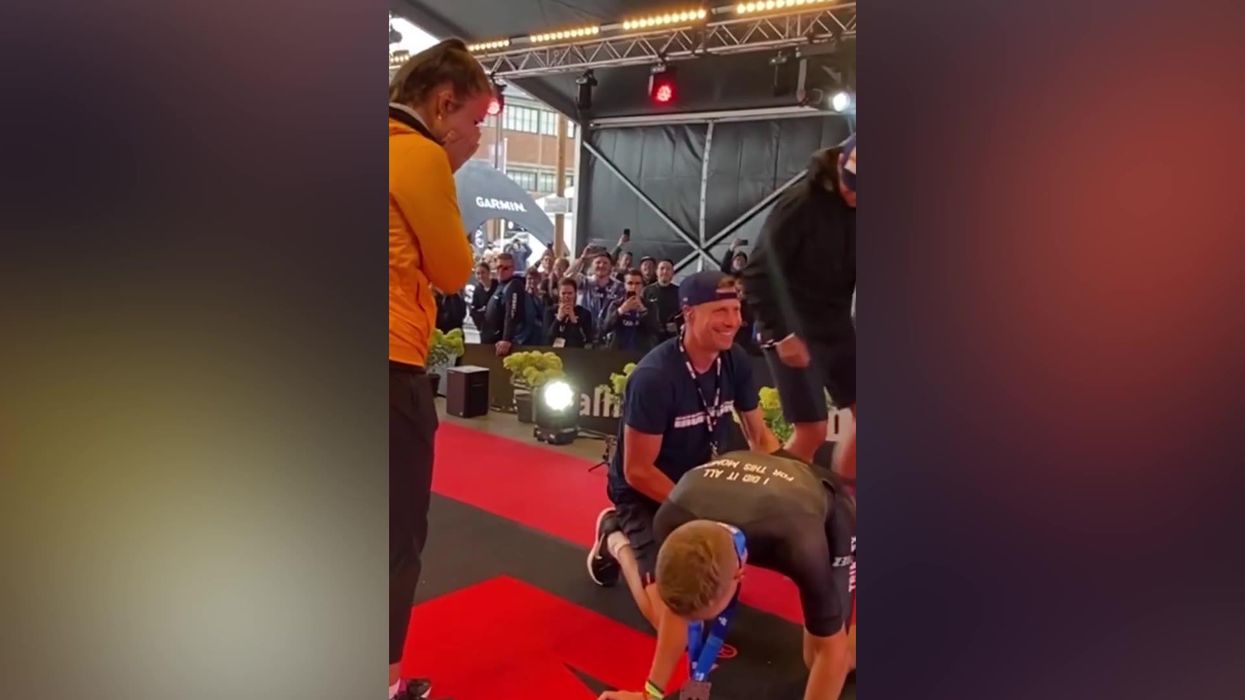 Man proposes despite collapsing with leg cramps after completing Ironman triathlon
