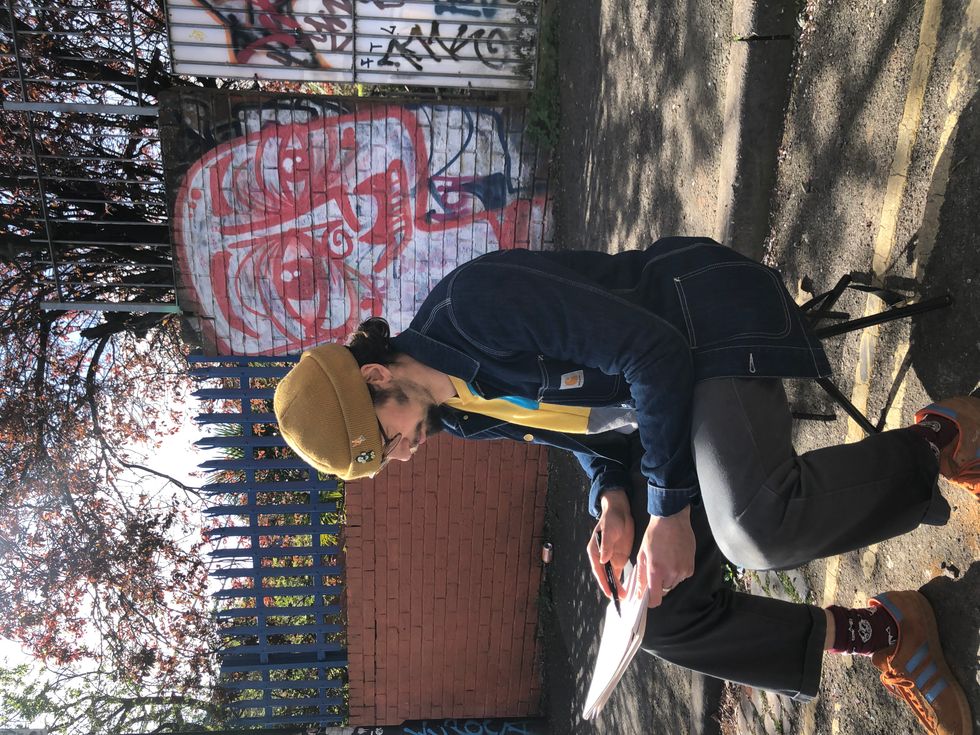 Man sitting and drawing