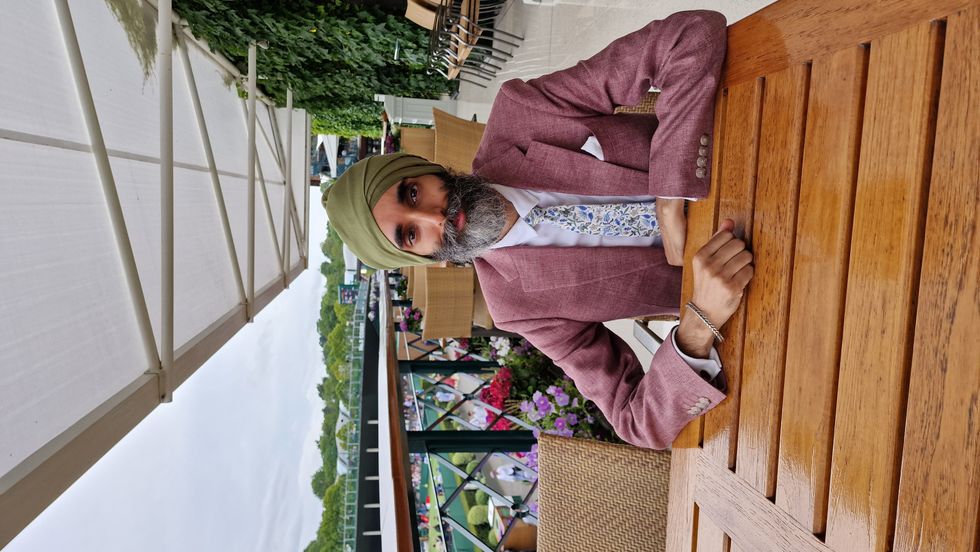 Man sitting down and looking at the camera