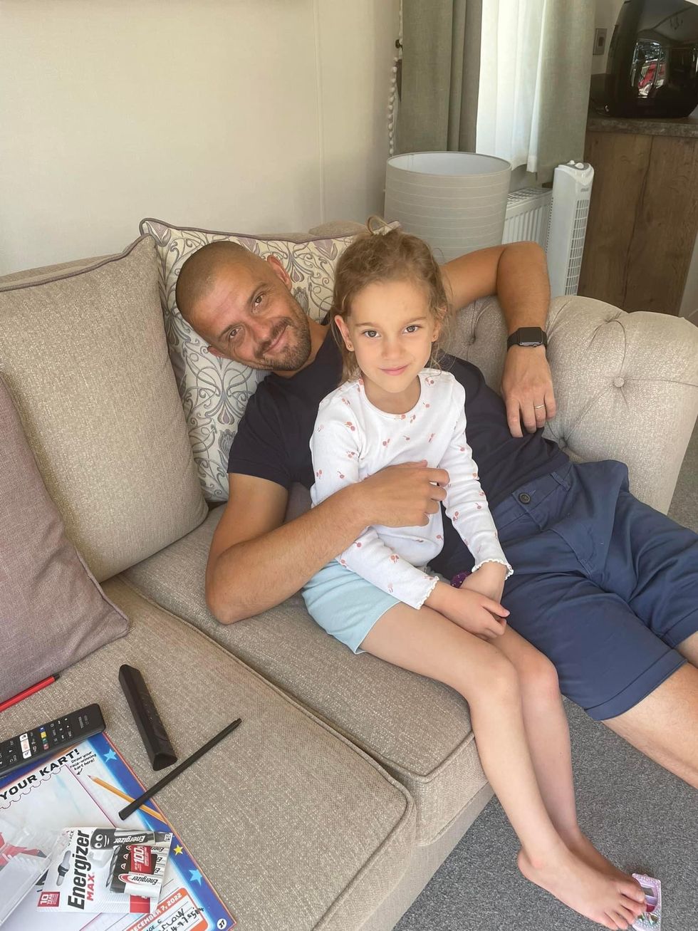 Man sitting down with his daughter