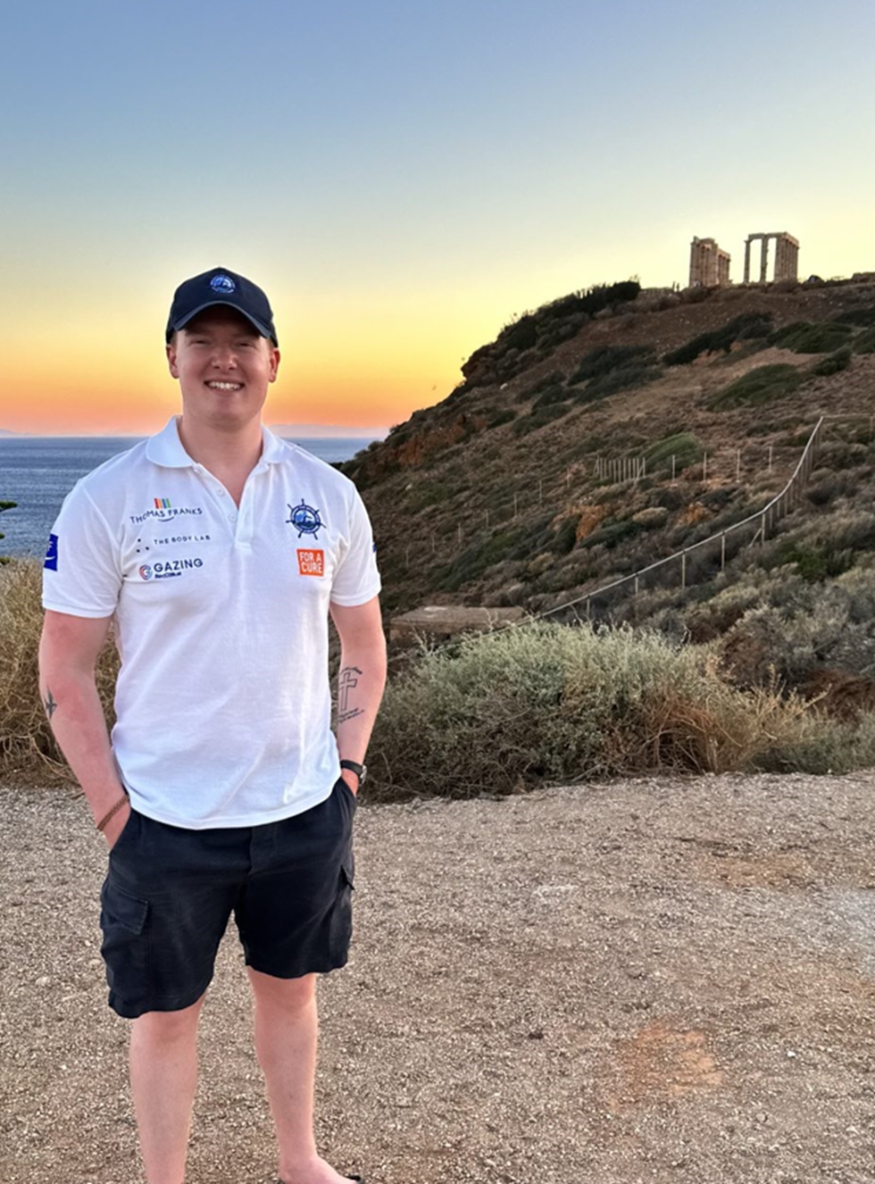 Man standing and smiling at the camera