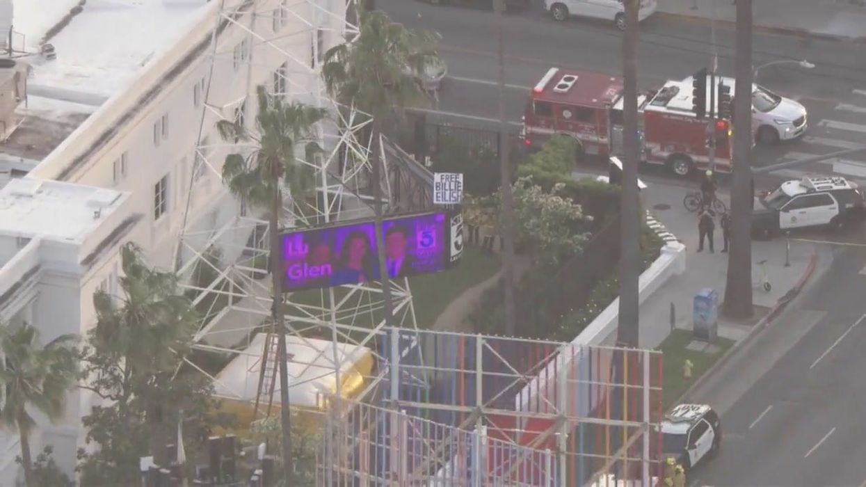 Moment reckless Billie Eilish fan climbs 162-foot LA studio tower to 'free' pop star