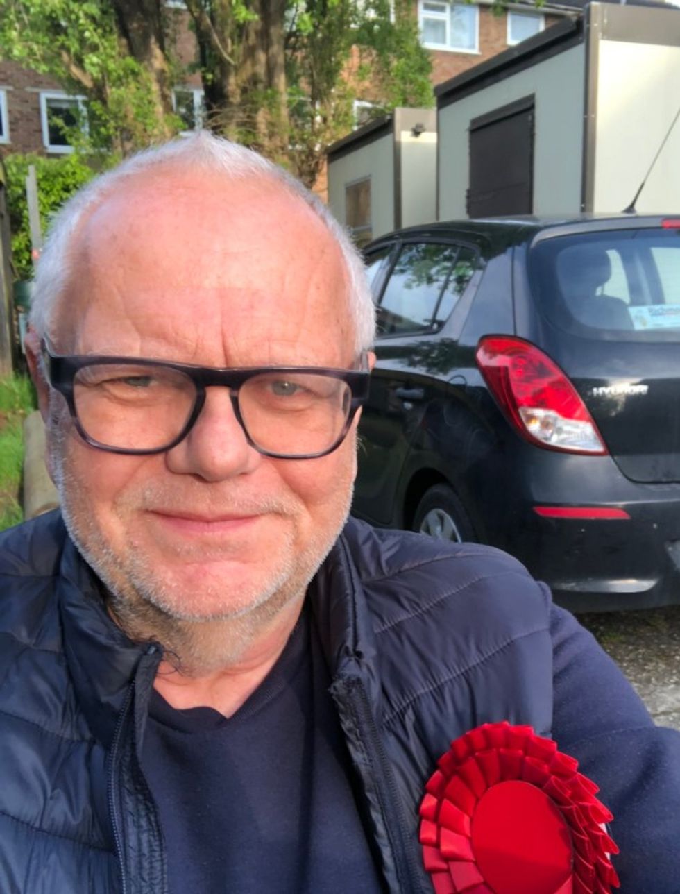 Man with glasses taking a selfie