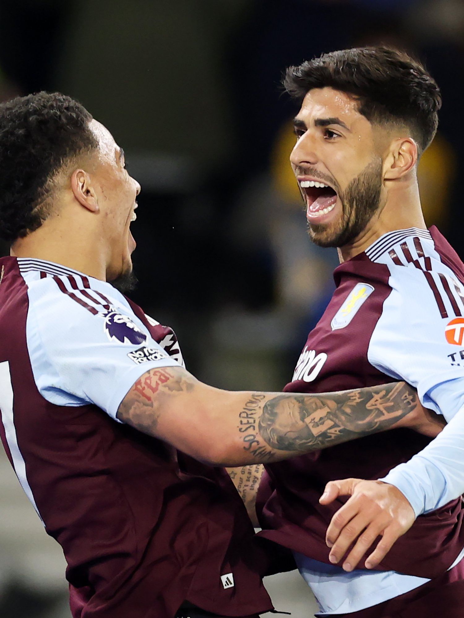 Marco Asensio of Aston Villa celebrates scoring his team's second goal with teammate Morgan Rogers during the Premier League match between Brighton & Hove Albion FC and Aston Villa FC at Amex Stadium on April 02, 2025 in Brighton, England