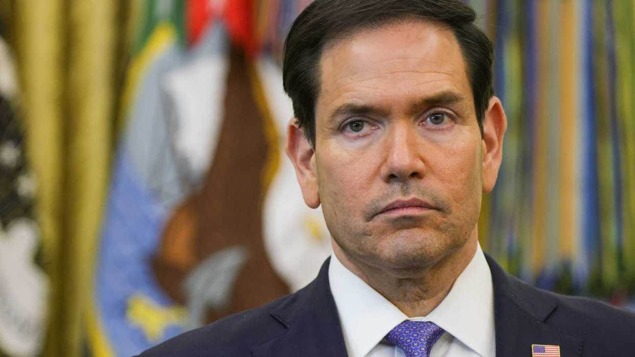 Marco Rubio, a white man with short black hair and neutral facial expression, in the Oval Office.