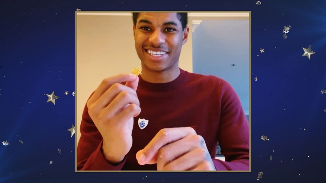 Marcus Rashford getting a Blue Peter badge