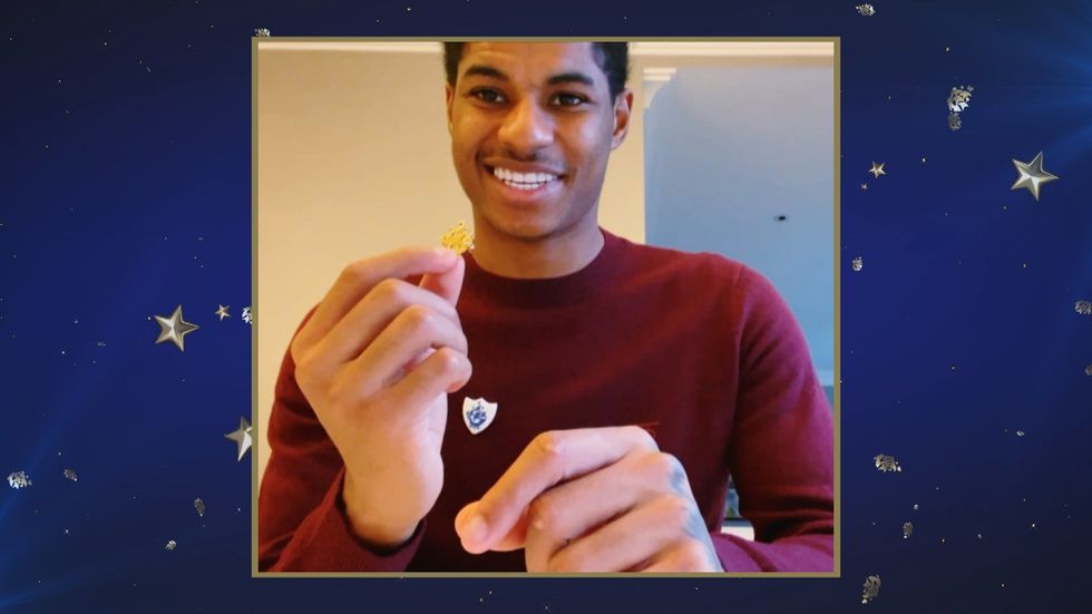 Marcus Rashford getting a Blue Peter badge