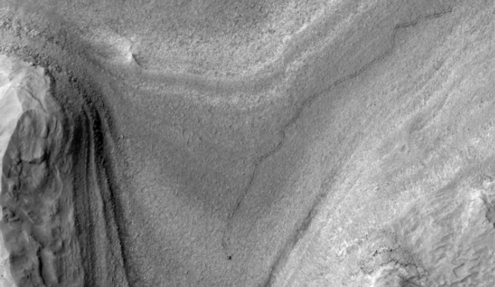 Mars orbiter captured an image of the Rover driving across the planet's surface