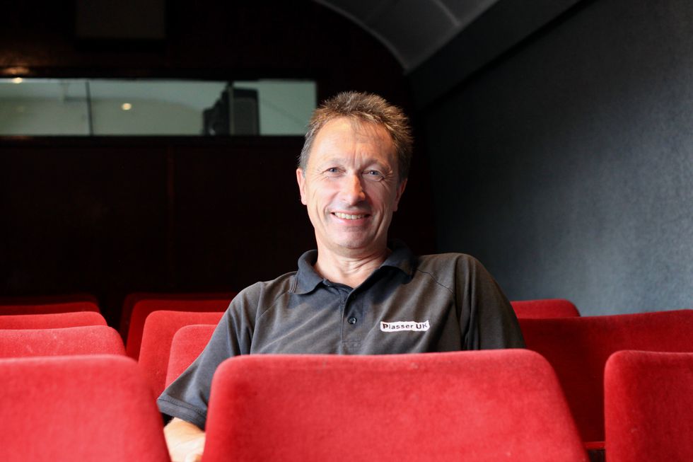 Martin Rouse, who led a team of volunteers carrying out the restoration, gets ready to watch a film (Railway 200/PA)