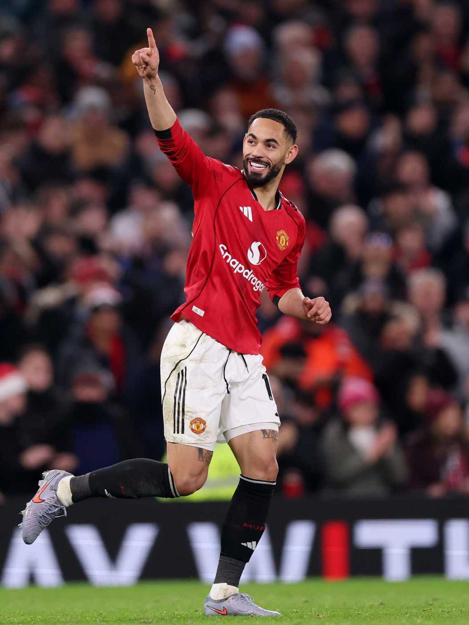 Matheus Cunha of Manchester United celebrates scoring his team's fourth goal during the Premier League match between Manchester United and Bournemouth at Old Trafford on December 15, 2025 in Manchester, England